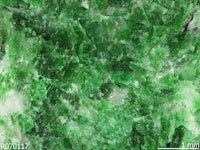 a close up of a green and white rock