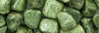 a close up of green jasper stones