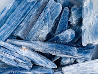 a pile of blue crystals in a bowl